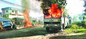 Imphal East: Angry people set on fire vehicles in Imphal East district on Sunday in protest against the United Naga Council (UNC)'s indefinite economic blockade. PTI Photo  (PTI12_18_2016_000164B)