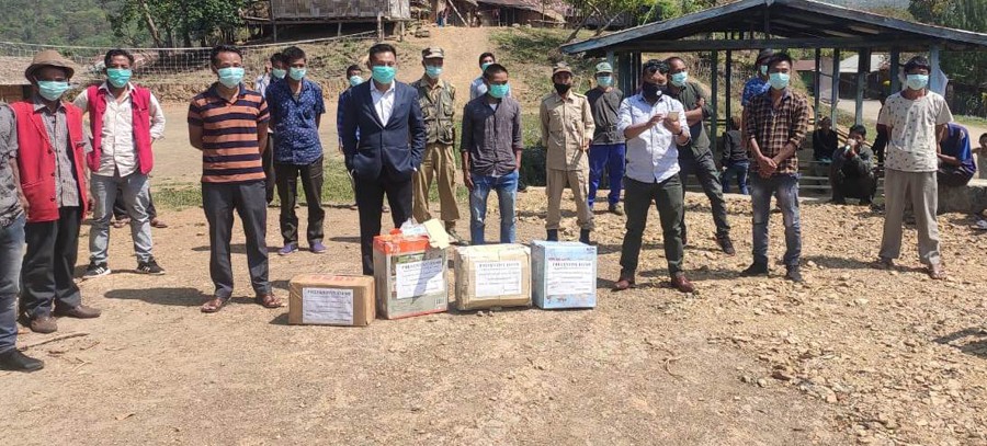 Yanithung N Ngullie and personnel of the sub-divisional task force during the distribution of personal protective equipment donated by EE Pangteang on April 13.
