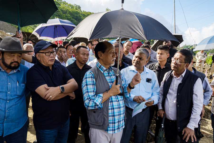 Neiphiu Rio and others inspecting the landslide-hit NH-2 at Phesama area on Tuesday. (EM Images)