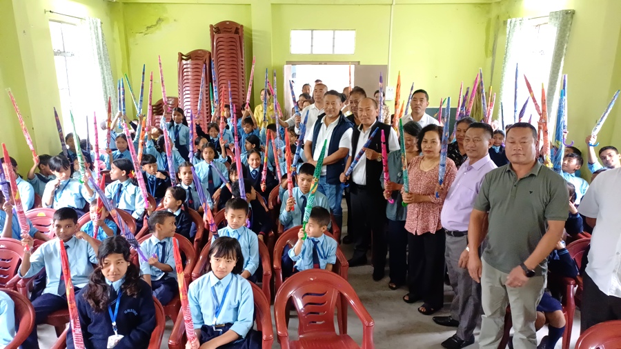 MLA Rhutso distributes umbrellas to government school students in Kohima