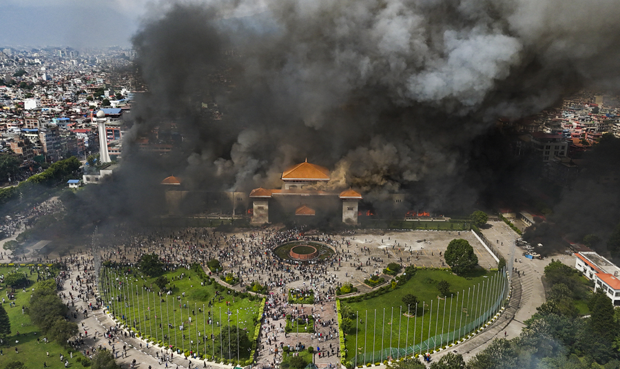 Violence continues in Nepal Protesters set fire to government buildings, leaders' houses